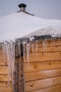 Icicles on the roof of wooden Hut Royalty Free Stock Photo