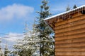 Icicles and snow on an old wooden cottage Royalty Free Stock Photo