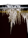 Icicles and snow on roof closeup. Winter weather concept. Froze and ice background. Snow and icicle. Melting icicles. Icicles and Royalty Free Stock Photo