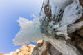 Icicles sokuy hanging over the head with a rock Olkhon Island on Royalty Free Stock Photo