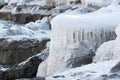 Icicles on stones at the thawing river