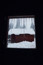 Icicles. View from a cottage window in heavy winter in the mountains Royalty Free Stock Photo