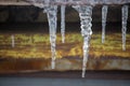 Icicles on vintage roof closeup. Winter weather concept. Froze and ice background. Snow and icicle. Melting icicles.