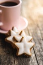 Icing gingerbread stars. Traditional Christmas cookies Royalty Free Stock Photo