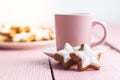 Icing gingerbread stars. Traditional Christmas cookies on pink wooden table Royalty Free Stock Photo