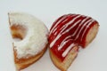 Icing powdered confectioners' sugar and Strawberry flavored ring donut, A glazed, yeast raised, American style ring doughnut