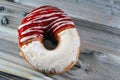 Icing powdered confectioners' sugar and Strawberry flavored ring donut, A glazed, yeast raised,