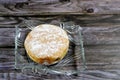 Icing powdered sugar donut filled with strawberry sauce, a doughnut or donut, a type of food made from leavened fried dough, Royalty Free Stock Photo