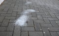 Icing protection on the pavement is sprinkled with salt. the salt melts the ice into a harmless slurry. the salt layer is too high