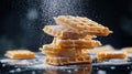 Icing sugar falling on a stack of freshly baked waffles Royalty Free Stock Photo