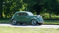 Vintage 1950 Ford V8 Pilot 3.6 Litre Car driving past on country road.