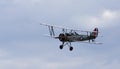 Vintage 1931 Avro 621 Tutor biplane aircraft flying.