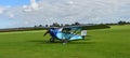 Vintage 1931 Civilian Coupe 02 G-ABNT aircraft on airstrip grass..