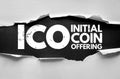 ICO Initial Coin Offering text concept on torn paper. Cryptocurrency fundraising method acronym in bold letters symbolizing Royalty Free Stock Photo