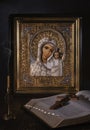 Icon of the Kazan mother of God in a gold frame, embroidered with pearls and beads.