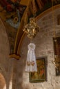 An icon lamp hangs from the ceiling in a hall in the small monastery of St. George on the border of the Jewish and Armenian