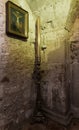 Icon and a large candlestick in the room under Calvary in the Church of the Holy Sepulchre in the Old City in Jerusalem, Israel Royalty Free Stock Photo