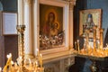 Icon of Mother of God and burning candles in church of St. Peter`s Basilica. Close up shot. Large Christian Catholic