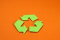 Icon of recycling made of green paper, the concept of protection, preservation of the environment