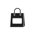 Icon of a shopping bag in a minimalist design. The bag is solid black with a rectangular Royalty Free Stock Photo