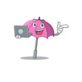 An icon of smart pink umbrella working with laptop