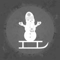 Icon snowman on a sleigh on gray vintage background .
