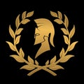 Icon the Spartan helmet in a laurel wreath from gold Royalty Free Stock Photo