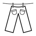 Icon with trousers dries on clothespins.