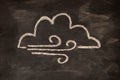 Icon for weather forecast, cloudy, windy, chalk drawn on blackboard.