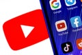 The icon of the Youtube social media platform application among other applications on the smartphone screen Royalty Free Stock Photo