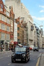 The iconic black cab on Fleet street in London