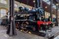 Iconic black steam engine locomotive on display at Pietrarsa National Railway Museum in Italy