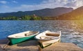 Iconic Bled scenery. Boats at lake Bled, Slovenia, Europe. Wooden boats with Pilgrimage Church of the Assumption of Maria on Royalty Free Stock Photo