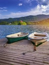 Iconic Bled scenery. Traditional wooden boats Pletna at lake Bled, Slovenia, Europe. Wooden boats with Pilgrimage Church of the Royalty Free Stock Photo