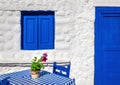 Iconic blue table with wooden chairs , Greece Royalty Free Stock Photo