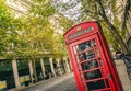 British Red Telephone Box in London street, England, UK Royalty Free Stock Photo