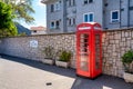 Iconic british old red telephone box at the entrance in Gibraltar Royalty Free Stock Photo