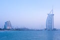 Iconic Burj Al Arab Hotel and the adjacent Jumeirah Colony. Evening scene Royalty Free Stock Photo