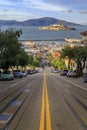 Iconic cable car tracks atop Hyde Street, with the famous Alcatraz Island in background in San Francisco, California USA