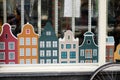 Iconic canal `Dancing houses` made of paper as a decoration in the window. Amsterdam, Netherlands