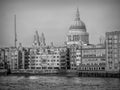 London Iconic cityscape featuring a dome and clock tower against a soft sky, showcasing architectural details Royalty Free Stock Photo