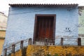 Iconic and colorful old houses and narrow streets typical of El Hatillo, where few people can be seen walking down the street