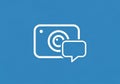 Iconic design showing a white camera outline with a speech bubble on a blue background. The camera Royalty Free Stock Photo