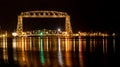 The iconic Duluth Minnesota Aerial Lift Bridge with reflections on calm harbor waters Royalty Free Stock Photo