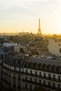 Iconic Eiffel Tower viewed from the city at sunset.