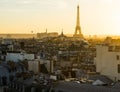 Iconic Eiffel Tower viewed from the city at sunset.