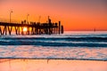 Iconic Glenelg Beach with blurred jetty at sunset