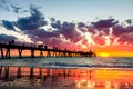 Iconic Glenelg jetty with people silhouettes at sunset