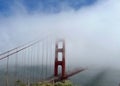 Iconic Golden Gate Bridge in San Francisco, California, shrouded in a blanket of fog. Royalty Free Stock Photo