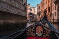 Iconic Gondola Gliding Along Peaceful Canal in Venice, Italy - Classic Venetian Architecture